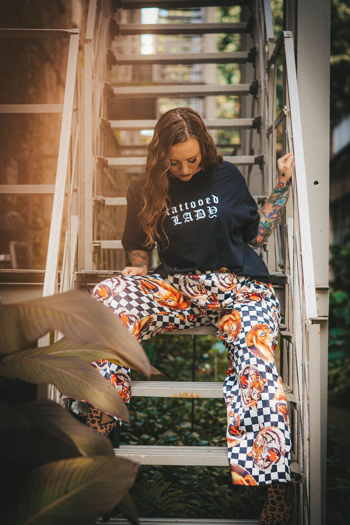 Woman in tattoos wearing the tattooed lady crop top. 